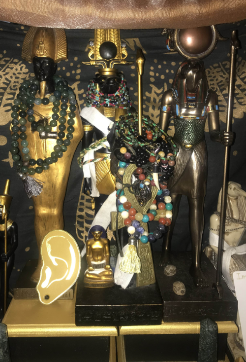 photograph of statues of wesir, sobek, and ra in my personal shrine